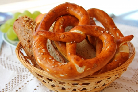 A basket of Freshly baked Bavarian Pretzel  Brezel  and other types of bread