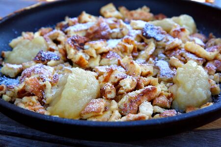 Delicious Traditional Austrian dessert   Kaiserschmarrn  Caramelized pancake served with apple sauce の写真素材