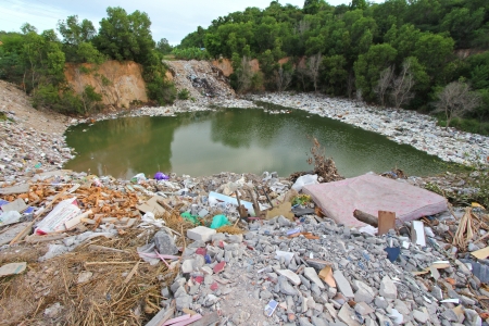 CHONBURI, THAILAND - JULY 2013   A mountain of dirty trash surrounding the lake in Chonburi Province...