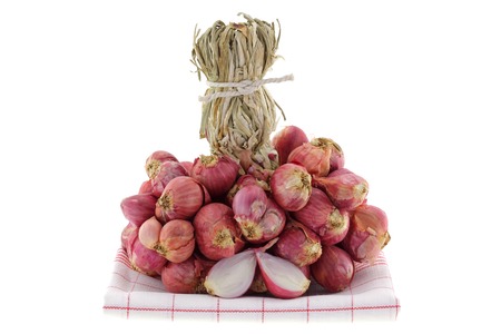 Shallot bulbs cut in half isolated on white background