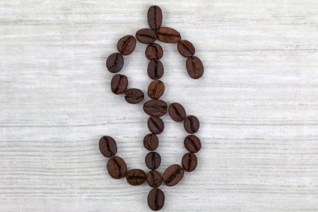 Coffee beans in a shape of Dollar signの写真素材