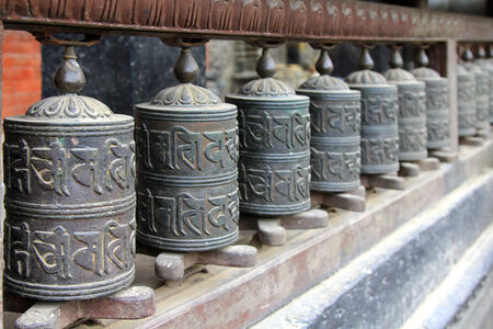 Praying wheels at Vidhadhar Varma Sanskarita Yasodhara Mahavihar, known as Bubahal, in Patan, Nepalのeditorial素材