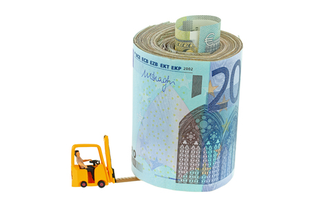 A miniature man sitting in a yellow forklift truck lifting a roll of money, isolated on whiteの写真素材