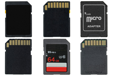 Different types of removable flash memory cards and Micro SD Adapter isolated on white