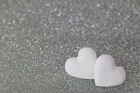 Soft focus of 2 heart shaped candy pills on silver glittery background with shallow depth of field with copyspace
sparklingの写真素材