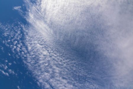 Natural blue sky with Cirrus radiatus, cirrocumulus clouds formation