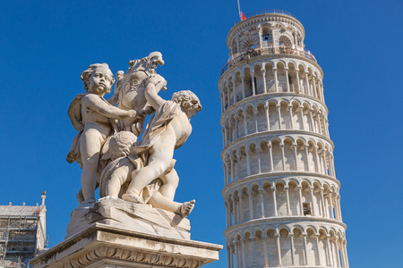 PISA, ITALY - SEPTEMBER 2016 : Leaning Tower of Pisa and status of cherubs winged angels in Pisa, Italy on September 22, 2016. Pisa Tower (Torre pendente di Pisa) is a freestanding bell tower campanile of cathedralのeditorial素材