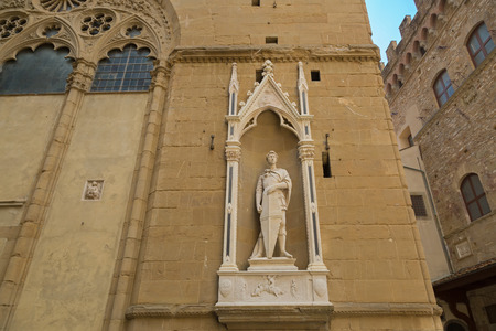 FLORENCE, ITALY - SEPTEMBER 2016 : Bronze statue of Saint George (Guild of Armourers and Swordmakers) by Donatello, detail of Orsanmichele church exterior with 1 of 14 external niche figures in Florence, Italy on September 21, 2016.のeditorial素材