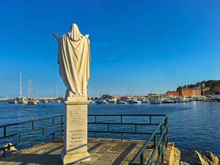 SANTA MARGHERITA LIGURE, ITALY - SEPTEMBER 2016 : Statue of Santa Margherita facing the sea at Tigullio Gulf of Santa Margherita Ligure, Italy on September 22, 2016. She prays for safe return of fishermenのeditorial素材