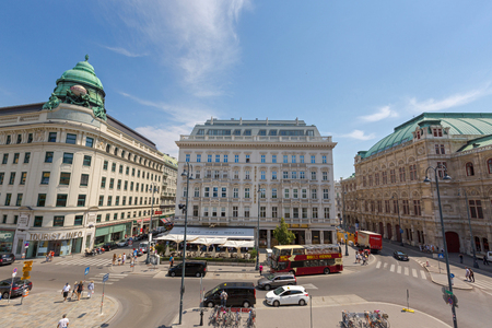 VIENNA, AUSTRIA - JULY 2018 : People, vehicle in front of cafe, hotel, state opera, on Albertina in the Innere Stadt (First District) of Vienna, Austria on July 17, 2018.のeditorial素材