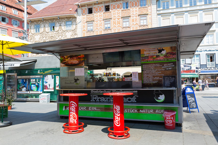 GRAZ, AUSTRIA - JULY 2018 : Austrian fast food shop, sausage stand in Graz, Austria on July 20, 2018. It's called Schnellimbiss in German languageのeditorial素材