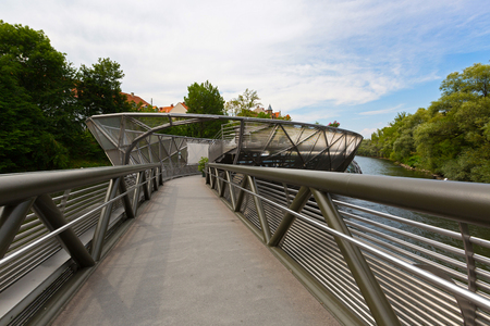 GRAZ, AUSTRIA - JULY 2018 : Murinsel bridge across Mur river in Graz, Austria on July 20, 2018. It is an artificial floating island.のeditorial素材