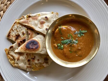 Nepali breakfast meal, Paratha stuffed bread dish with Egg curry served in Nepal in morning, top...