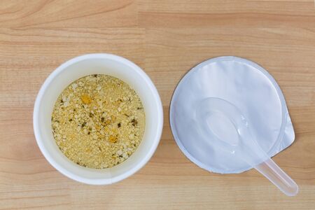 Top view of Instant pre cooked rice porridge soup with dried pork meat and flavorの写真素材