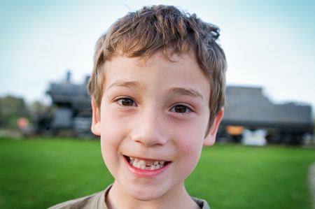 boy and an old steam engine