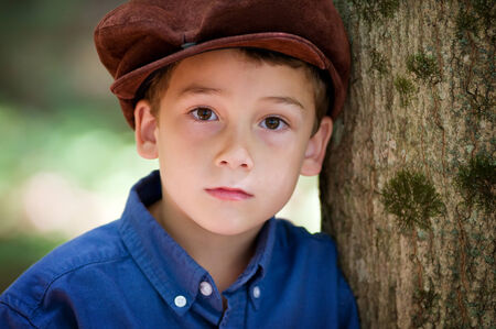 young boy wearing a page boy cap 