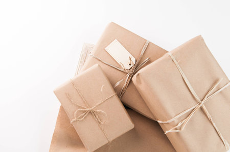 packages wrapped in brown paper and tied with twineの写真素材