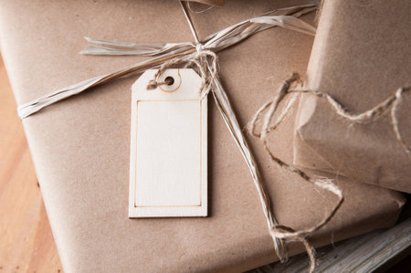 packages wrapped in brown papper and tied with string for Christmasの写真素材