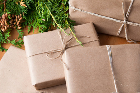 packages wrapped in brown papper and tied with string for Christmasの写真素材