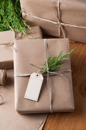 packages wrapped in brown papper and tied with string for Christmasの写真素材