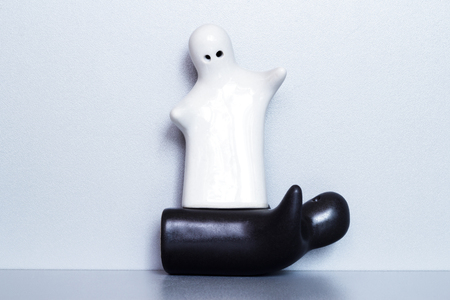 Two ceramic figures on a gray backgroundの写真素材