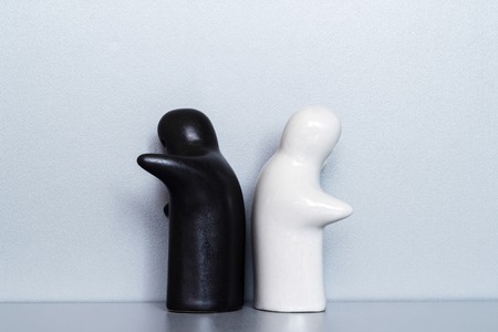 Two ceramic figures on a gray backgroundの写真素材