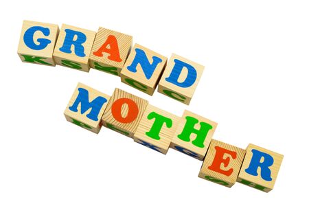 Wood cube with inscription GRANDMOTHER isolated on a white backgroundの写真素材