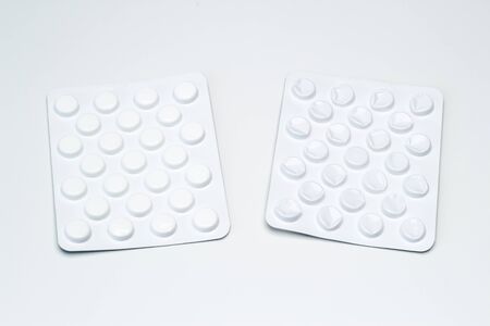 Blister with pills and empty on a white backgroundの写真素材