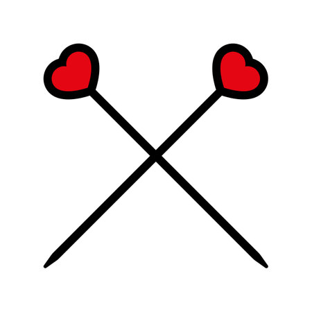 Crossed knitting needles with red hearts.のイラスト素材