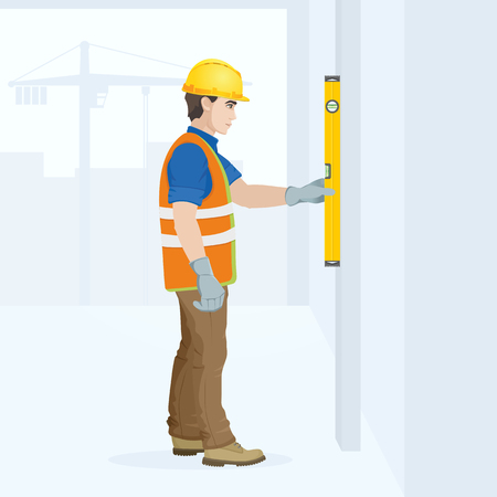 A man is a construction worker in overalls in the workplace with a tool in his hands. Vector illustration.のイラスト素材