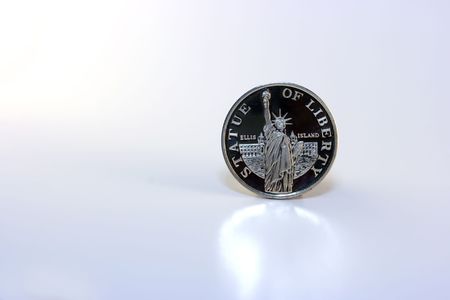 Golden plated coin witn Statue of Libertyの写真素材