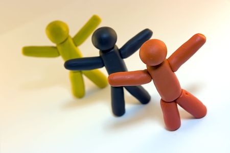 Three plasticine men standing isolated on white backgroundの写真素材