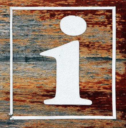 Information icon painted on wood with white paintの写真素材