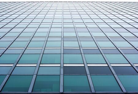 Skyscraper wall with a lot of office windowsの写真素材