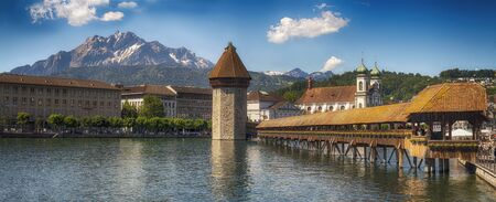 Lucerne, Switzerland June 2 2019: Panoramic view of wooden Chapel bridge and old town of Lucerne
