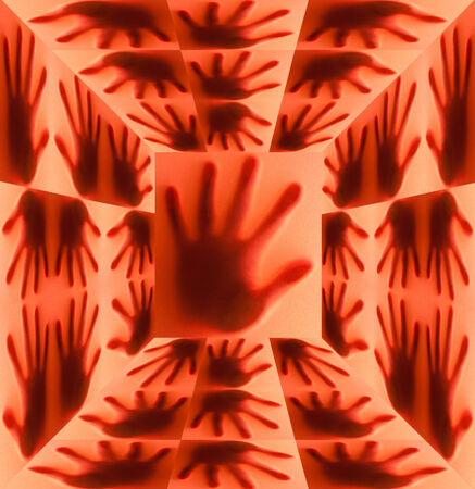 Silhouette of hand on red roomの写真素材