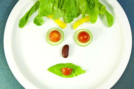 Face decorated with vegetablesの写真素材