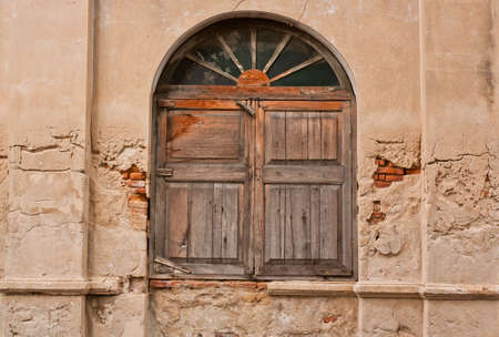 Ancient wooden window with concrete wall old の写真素材