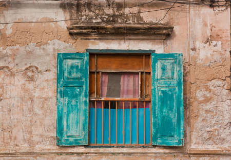 Old window with blue shutters  Background  の写真素材