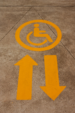 Arrow symbol for disabled wheelchair passenger の写真素材