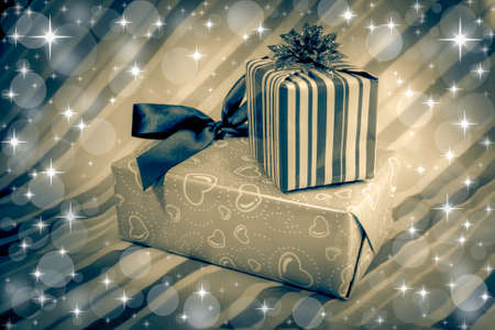 Holiday gift on glitter background.