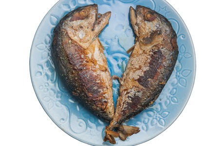 Fried mackerel in plate on a white background.の写真素材