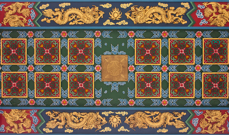 Decorative sculpture on the ceiling of a Chinese temple in Thai.の写真素材