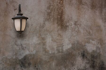Old lamp and cement wall, Vintage style.の写真素材