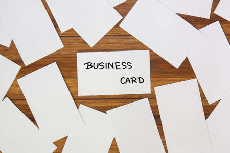 Many business cards on a wooden background.の写真素材