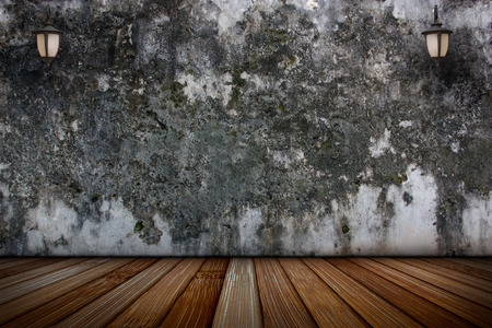 The lamp on the plaster walls and old wooden floors, Abstract background.の写真素材