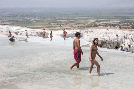 Turkey, Pamukkale, young people enjoy the unusual scenerのeditorial素材