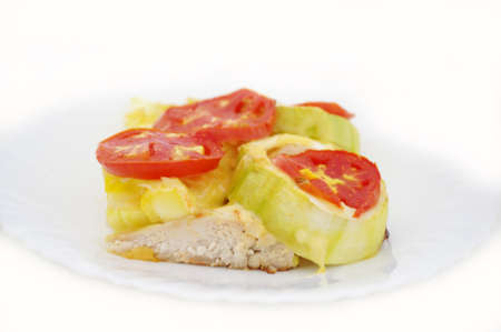 chiken with zucchini  and tomato on white undegroundの写真素材