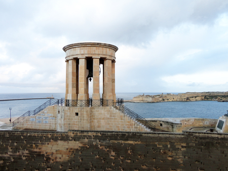 The Siege Bell War Memorial at Lower Barrakka Gardens Valletta, Maltaの写真素材