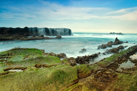 Sunset with coral texture at Sawarna Beach West Java Indonesia. Soft focus due to long exposure shot.の写真素材
